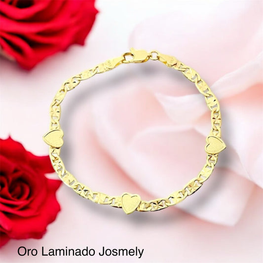 Gold bracelet with three hearts